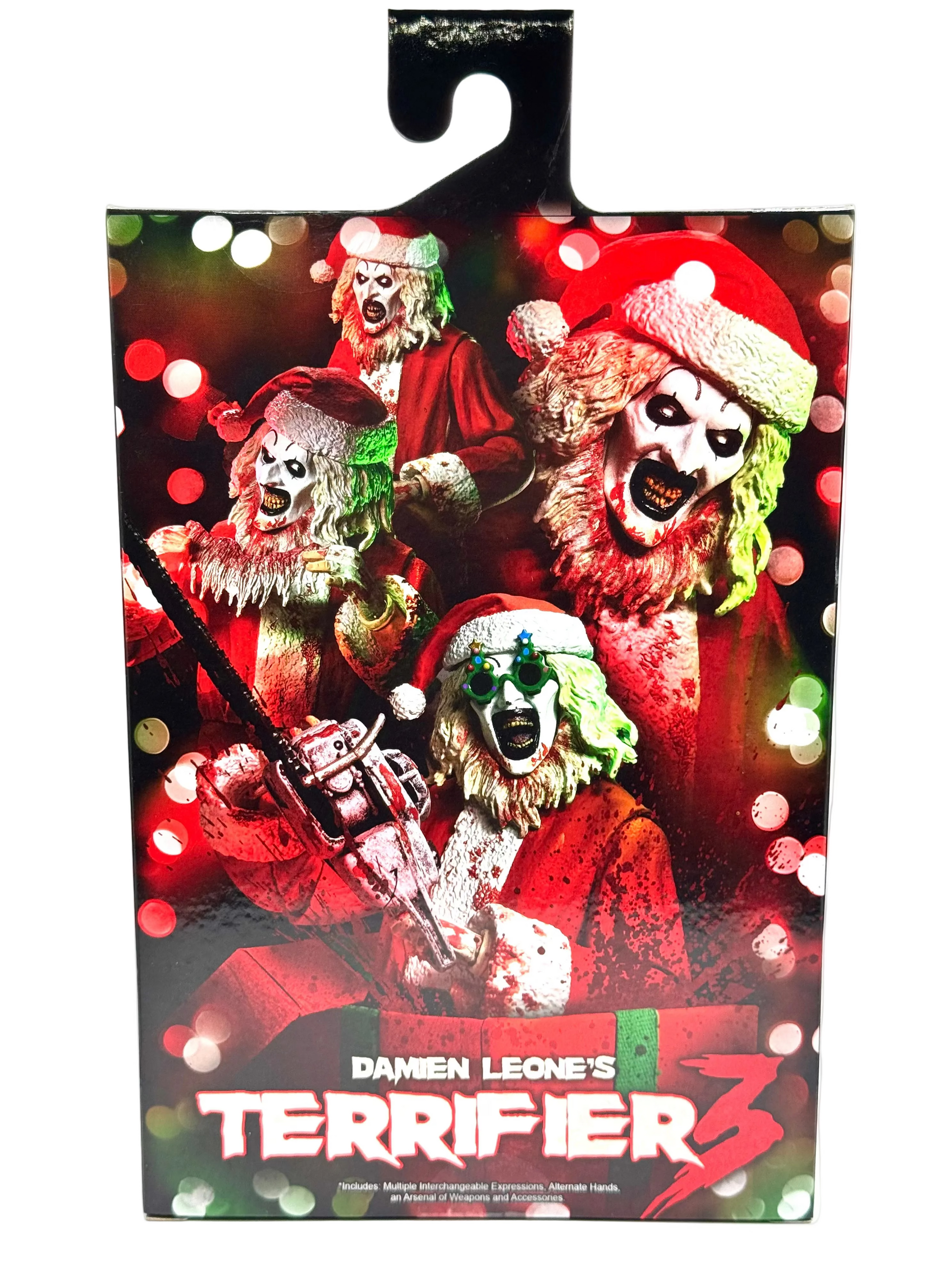 Packaging of 'Terrifier 3' with characters in Santa hats and a chainsaw, surrounded by festive lights.