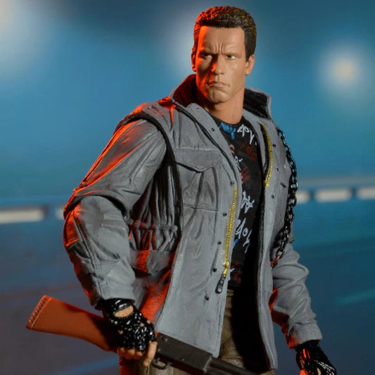 Action figure in a gray jacket holding a rifle against a dark background